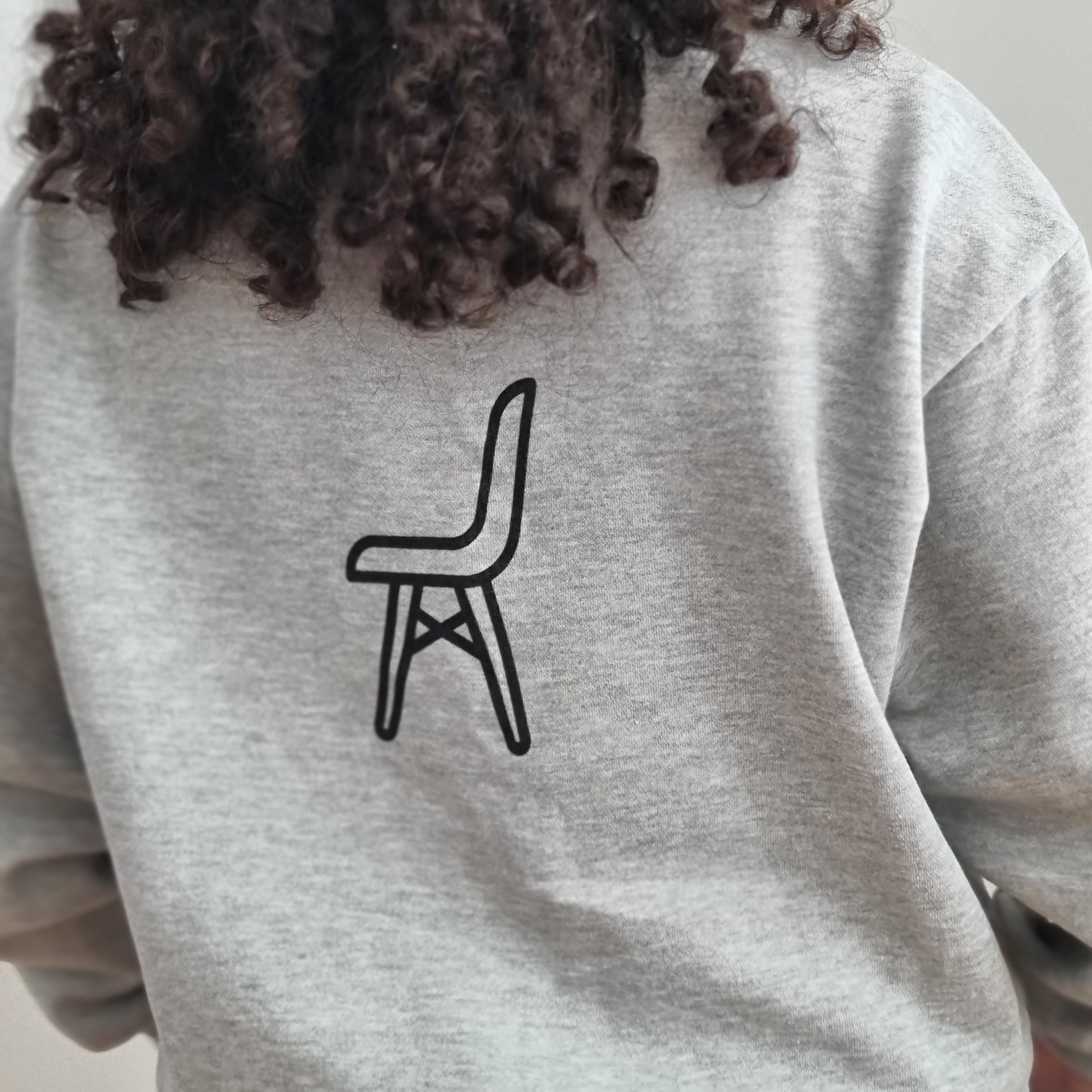 Do you even stack Bro? Is a quirky question printed in big bold capital print. Black on grey. Oversized fit. Fleecy lined. Back print is of a single chair.