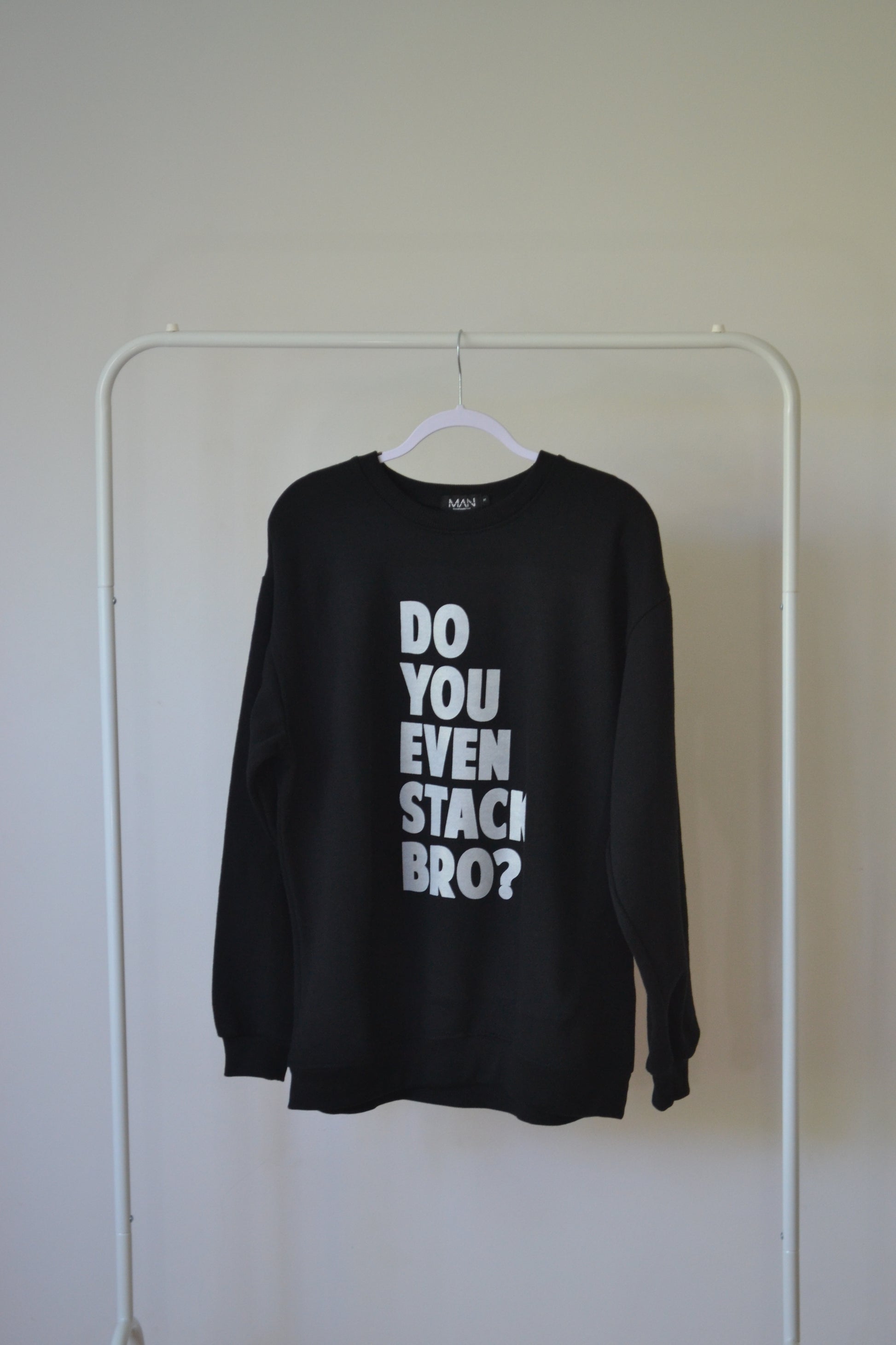 Do you even stack Bro? Is a quirky question printed in big bold capital print. White ink on black sweatshirt. Oversized fit. Fleecy lined. Back print is of a single chair.