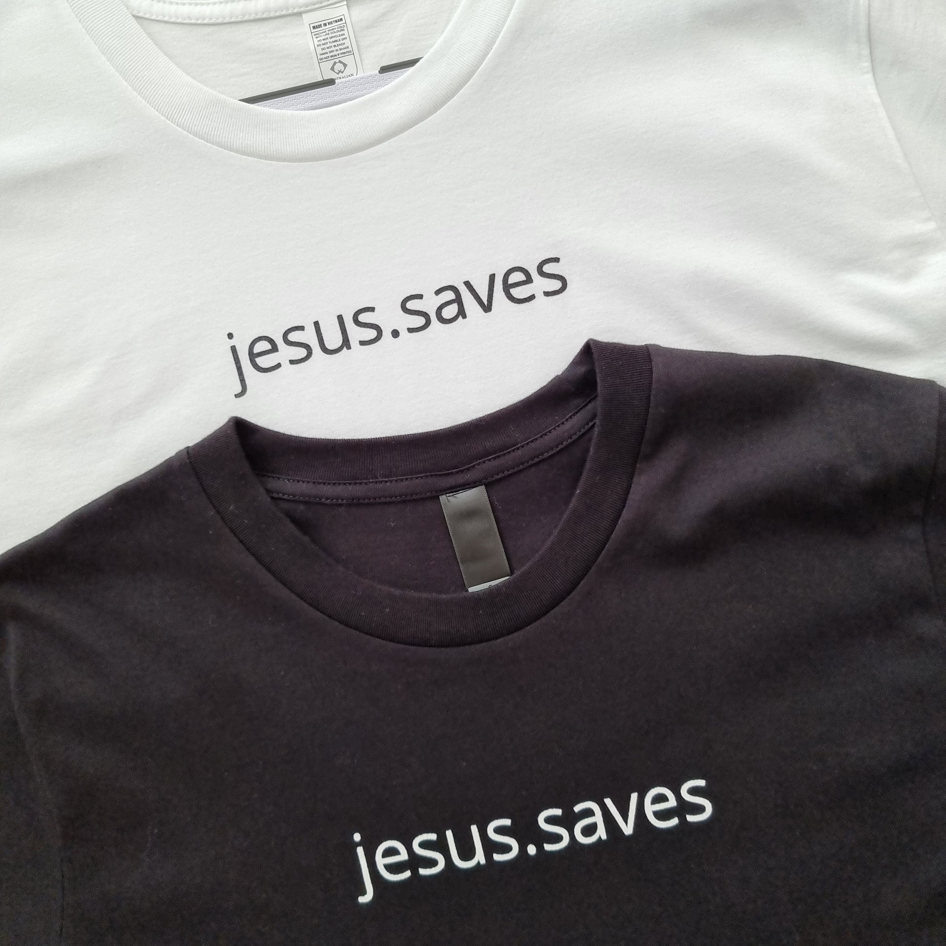 White or black shirts with jesus.saves written across the chest. Helping you to wear your faith in a stylish and powerful way Pair with a Blush jesus.saves Lightweight Sweatshirt to create a matching fit! Material: 100% Australian Cotton Screenprinted with plastisol ink Details: Straight Hem High chest print Bottom right SSD print. Pic is of one black and one white tee lying on the ground